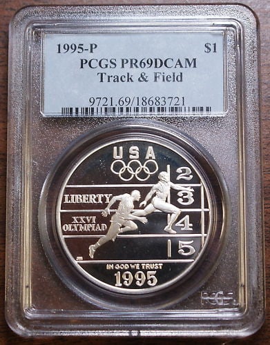 PCGS PR-69 DCAM 1995-P Track and Field Silver Dollar: PCGS PR-69 DCAM 1995-P Track and Field Silver Dollar This 1995-P Olympic Track & Field Silver Dollar has been graded PR-69 Deep Cameo by PCGS. The coin is in uncirculated condition and is free of noti