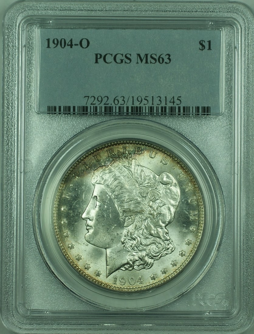 PCGS MS63 1904-O Morgan Silver Dollar New Orleans Mint Toned: PCGS MS63 1904-O Morgan Silver Dollar New Orleans Mint Toned This is a 1904-O Morgan Silver Dollar $1 coin, graded MS-63 by PCGS. The coin is uncirculated and features natural toning. It was minted in