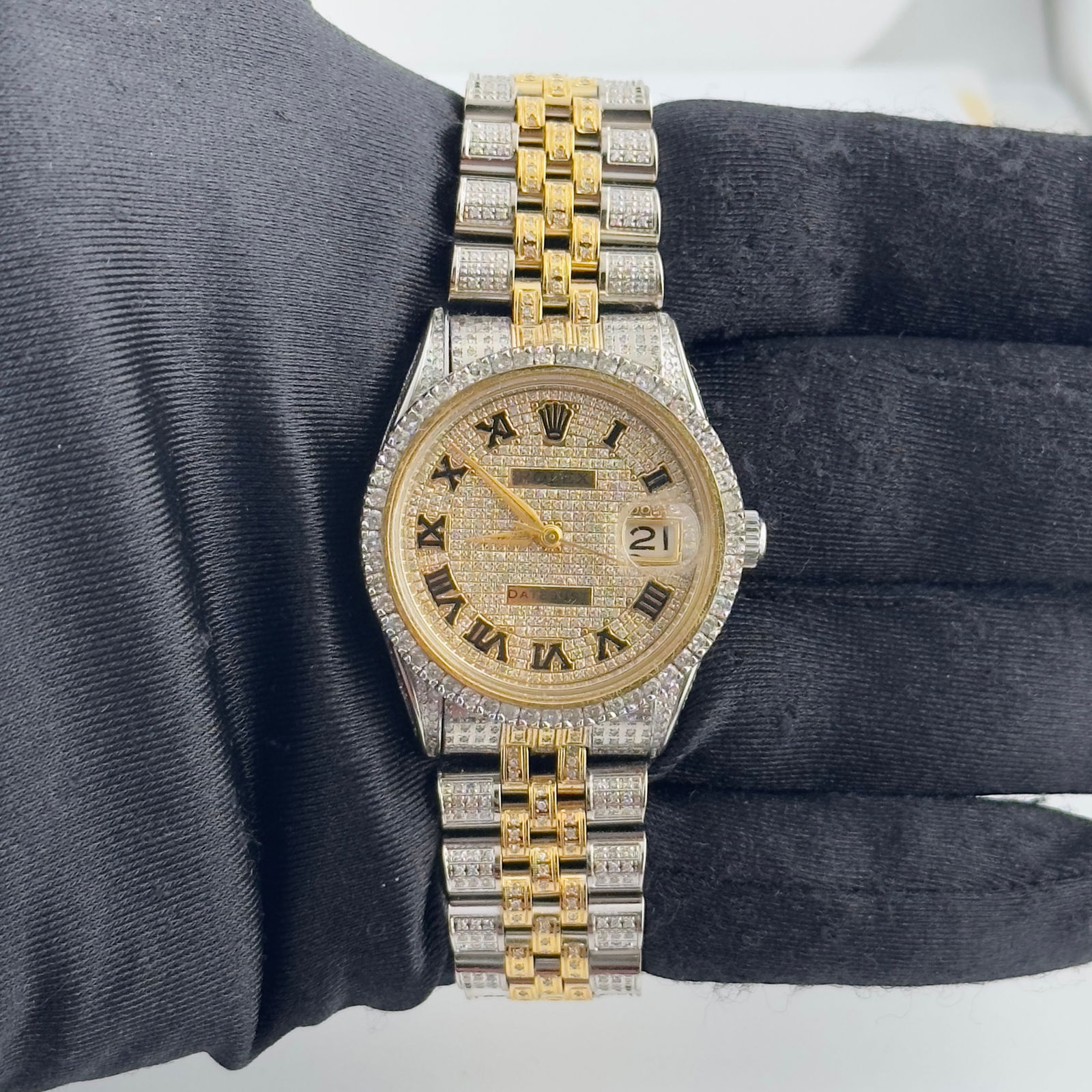 Iced Out Roman Dial Rolex Ref 6694 Aftermarket Jubilee Bracelet: Iced Out Roman Dial Rolex Ref 6694 Aftermarket Jubilee Bracelet This Rolex Oyster Perpetual Date features an iced out Roman numeral dial and a prong plated diamond bezel, paired with an Aftermarket Ju