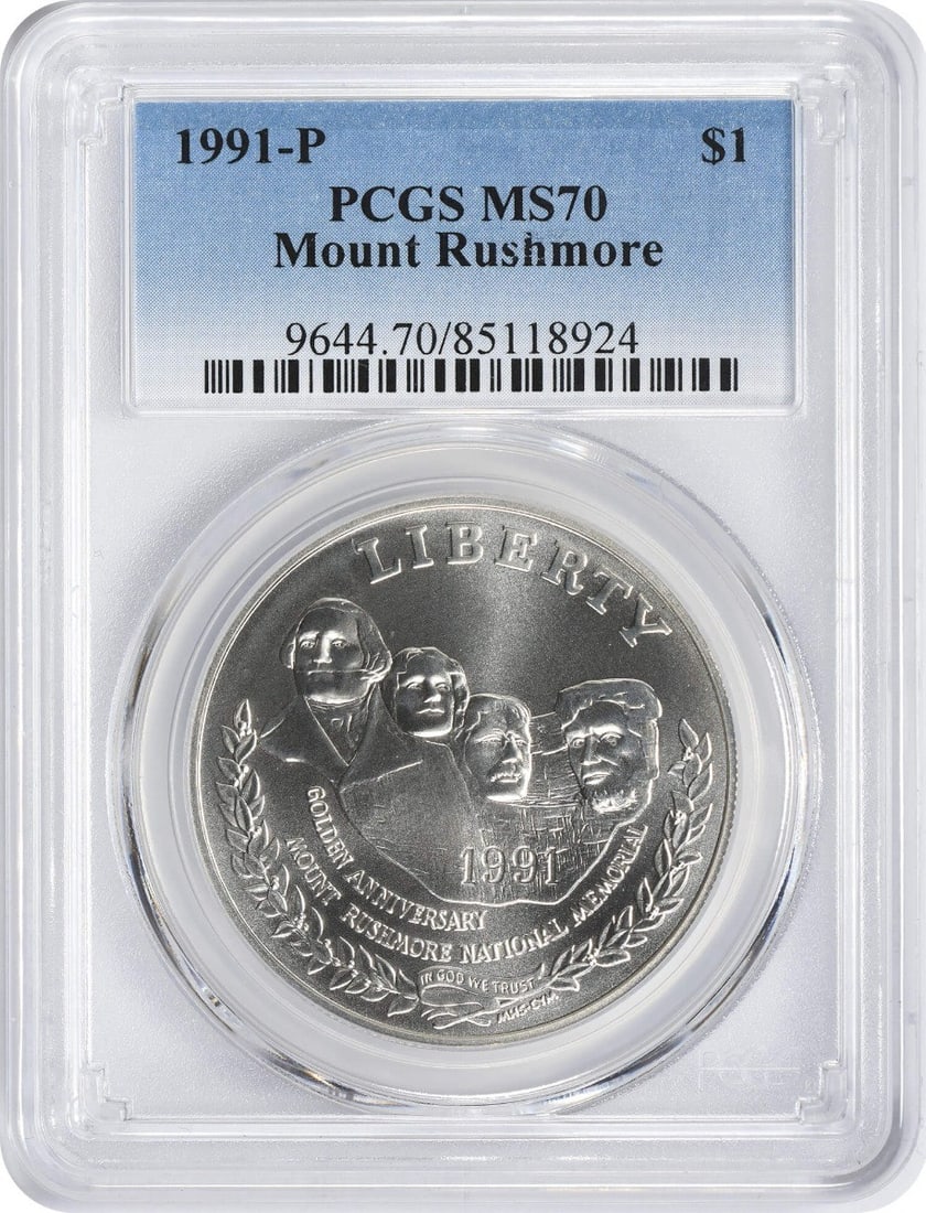 1991-P Mount Rushmore Silver Commemorative Dollar MS70 PCGS Uncirculated: 1991-P Mount Rushmore Silver Commemorative Dollar MS70 PCGS Uncirculated This 1991-P Mount Rushmore Silver Commemorative Dollar is a stunning tribute to one of America's most iconic landmarks. Graded