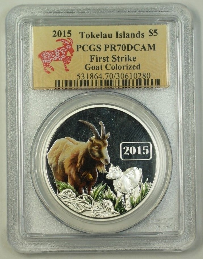 Colorized 2015 Tokelau Silver $5 Goat Family Coin PCGS PR-70 First Strike With COA: Colorized 2015 Tokelau Silver $5 Goat Family Coin PCGS PR-70 First Strike With COA This 2015 Tokelau Silver $5 coin features a colorized design of a goat family and is a first strike edition. Graded P
