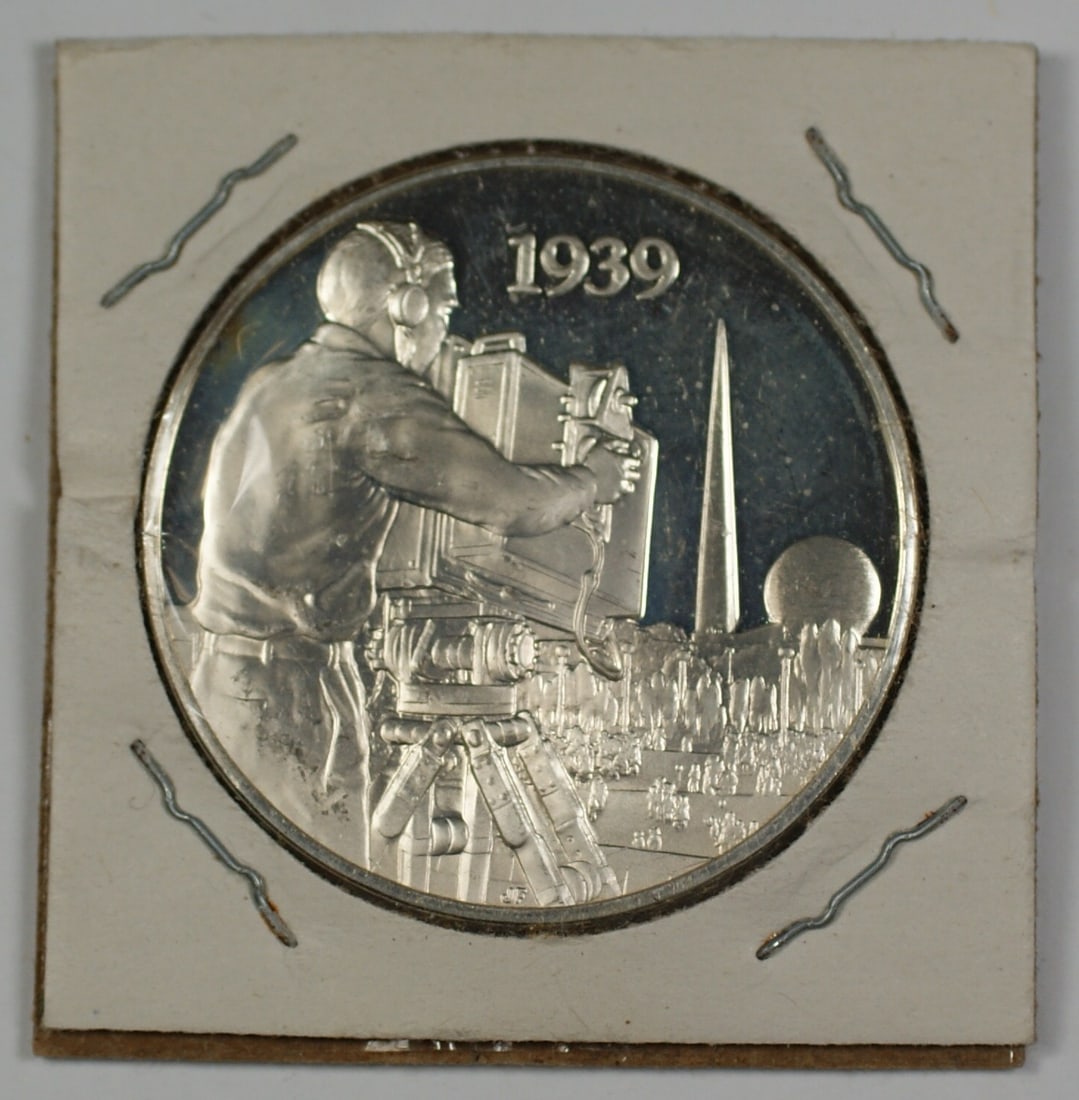 Silver Medal Celebrating Television Communications Revolution in Cardboard Holder: Silver Medal Celebrating Television Communications Revolution in Cardboard Holder This silver medal commemorates the communications revolution brought about by television. It is presented in a 2x2 car