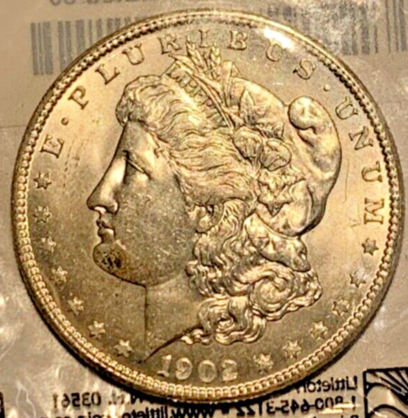 Uncirculated 1902-O Morgan Silver Dollar from New Orleans Mint: Uncirculated 1902-O Morgan Silver Dollar from New Orleans Mint This 1902-O Morgan Silver Dollar is an uncirculated coin from the New Orleans Mint. The coin features a silver composition and is conside