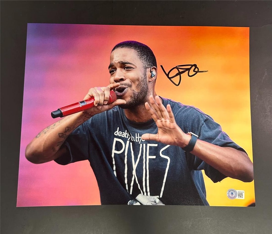 Kid Cudi Signed 11x14 Photo Autographed Beckett Authentic: Kid Cudi Signed 11x14 Photo Autographed Beckett Authentic This is an authentic 11x14 photo of Kid Cudi, the renowned rapper known for his album "Man on the Moon." The photo features a clear autograph