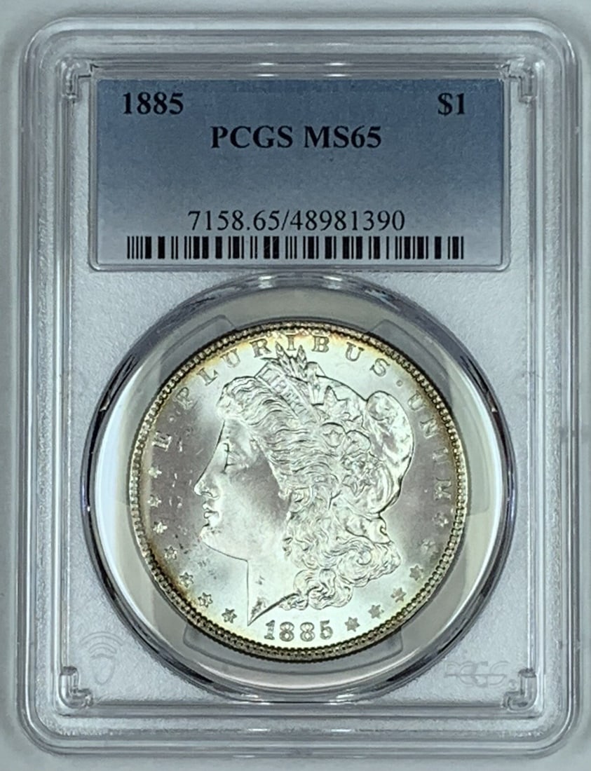 PCGS MS 65 1885 Morgan Silver Dollar Certified US Coin: PCGS MS 65 1885 Morgan Silver Dollar Certified US Coin This is an 1885 Morgan Silver Dollar coin from the United States, graded MS 65 by PCGS. The coin is uncirculated and composed of silver. It is pr