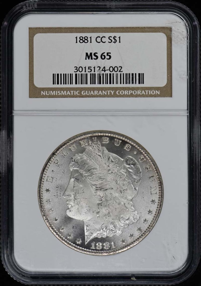 1881 Carson City Morgan Dollar NGC MS65 Uncirculated: 1881 Carson City Morgan Dollar NGC MS65 Uncirculated This 1881-CC Morgan Dollar is a stunning example of American coinage, featuring a high-grade MS65 certification from NGC. Struck in 1881 at the Car