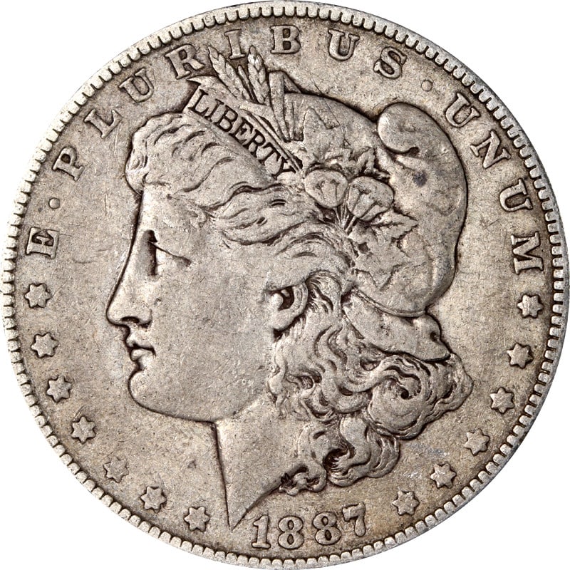 Circulated 1887 Over 6 Philadelphia Morgan Silver Dollar Coin: Circulated 1887 Over 6 Philadelphia Morgan Silver Dollar Coin This is a circulated 1887/6-P Morgan Silver Dollar composed of silver with a fineness of 0.9. The coin was minted in Philadelphia and is u