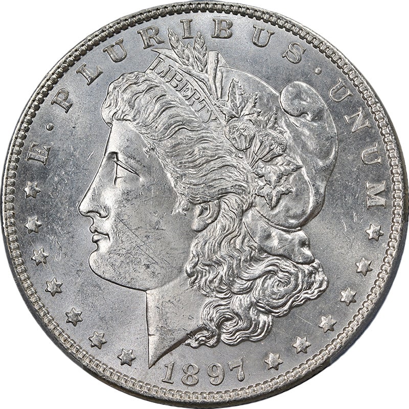 1897-P Morgan Silver Dollar PCGS MS63 Uncirculated Blast White: 1897-P Morgan Silver Dollar PCGS MS63 Uncirculated Blast White This stunning 1897-P Morgan Silver Dollar is certified by PCGS with a grade of MS63, showcasing exceptional eye appeal. The coin features