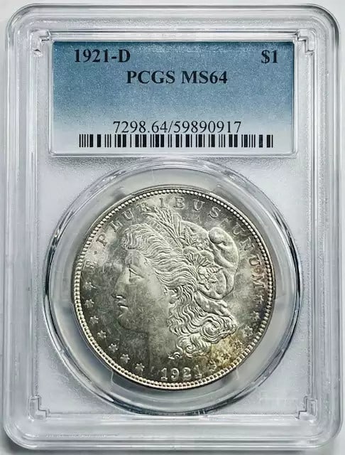 1921 D Morgan Silver Dollar PCGS MS64 Uncirculated Denver: 1921 D Morgan Silver Dollar PCGS MS64 Uncirculated Denver This 1921 D Morgan Silver Dollar is a stunning addition to any collection, graded MS 64 by PCGS, signifying its uncirculated condition. Minted