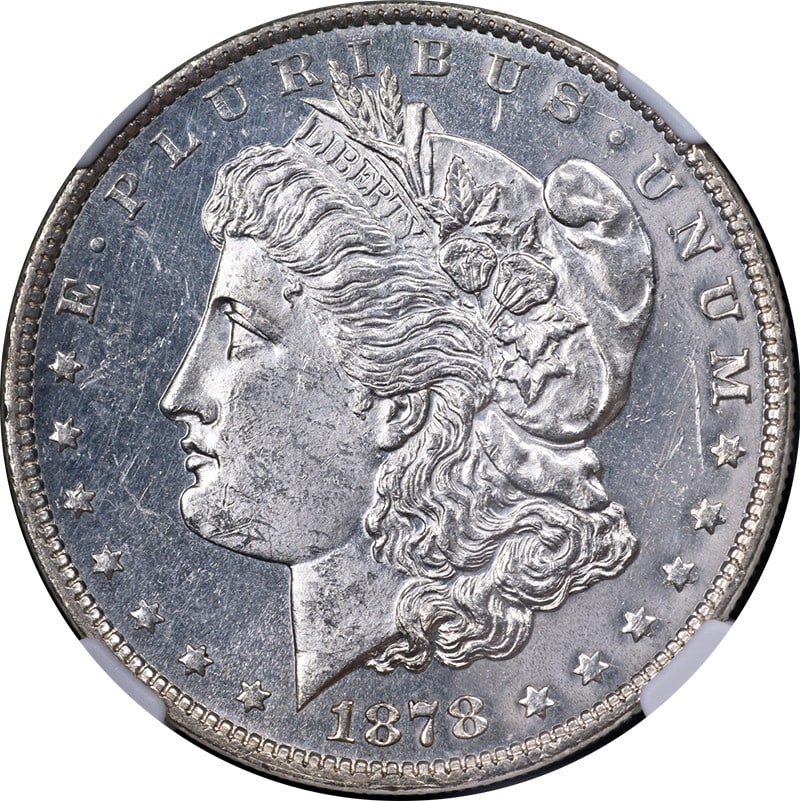 1878-P Morgan Silver Dollar NGC MS62 DPL Blast White Strong Strike: 1878-P Morgan Silver Dollar NGC MS62 DPL Blast White Strong Strike This 1878-P 7TF Rev 79 Morgan Silver Dollar is a stunning piece, featuring exceptional eye appeal and brilliant luster. The coin is c
