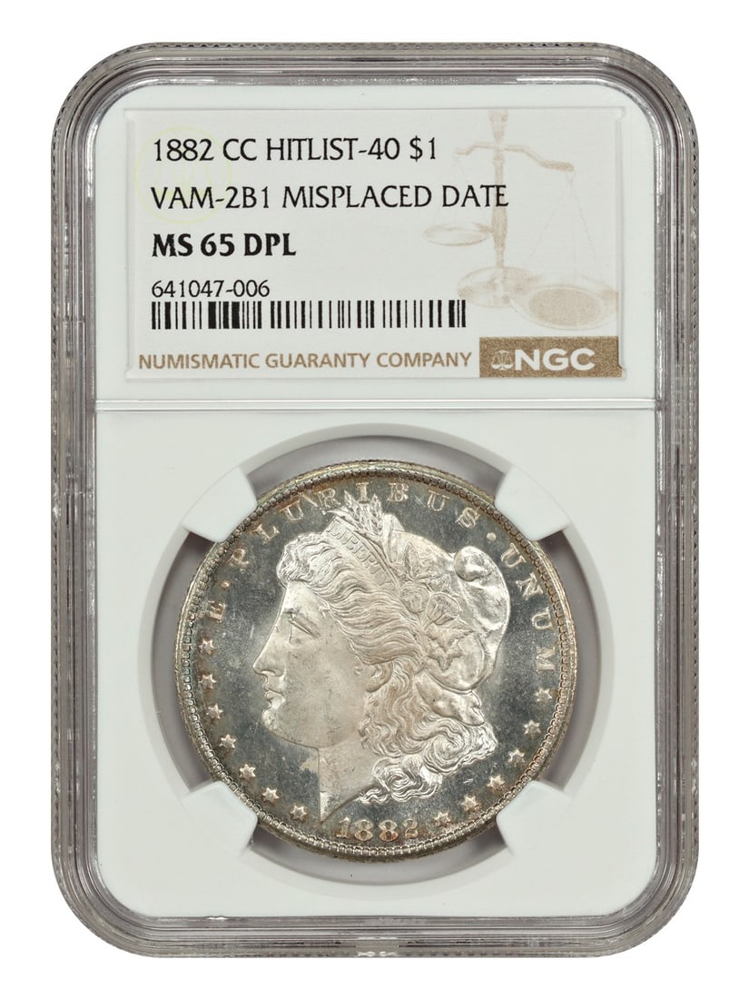 NGC MS65DMPL VAM-2B1 1882-CC Morgan Dollar with Misplaced Date: NGC MS65DMPL VAM-2B1 1882-CC Morgan Dollar with Misplaced Date This 1882-CC Morgan Dollar features the VAM-2B1 variety with a misplaced date, where the top of a '1' digit appears above the rim denticl