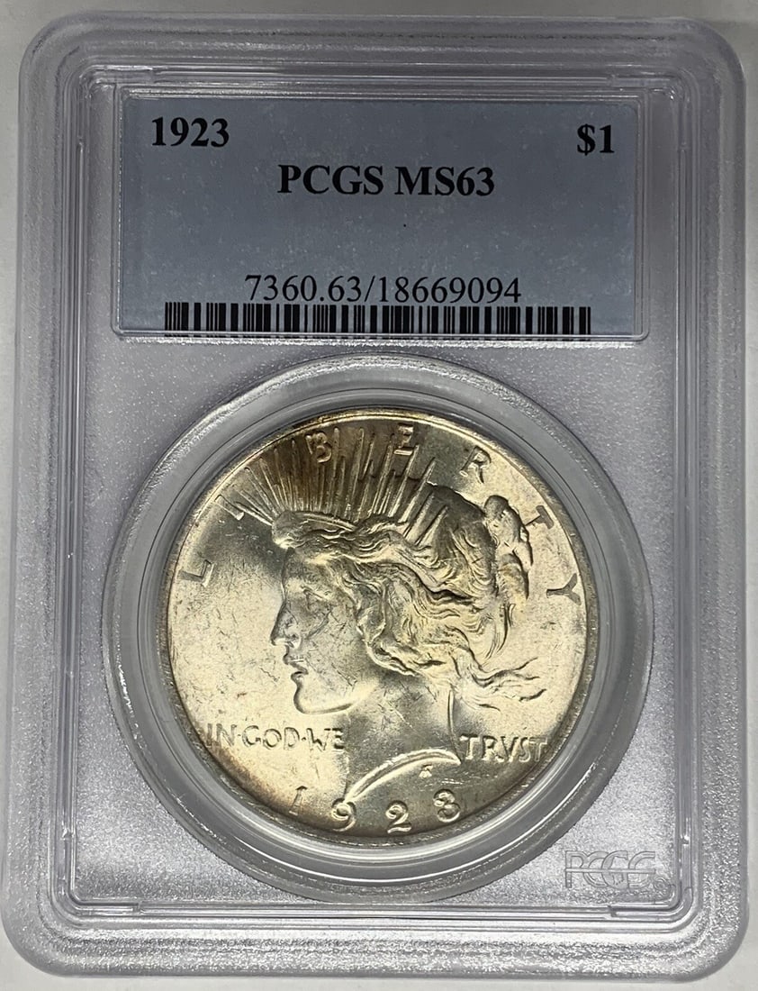 1923 Peace Dollar Silver Coin PCGS MS 63 Light Toning: 1923 Peace Dollar Silver Coin PCGS MS 63 Light Toning This 1923 Peace Silver Dollar coin is certified by PCGS with a grade of MS 63. It features a lightly toned finish and is composed of silver. The c