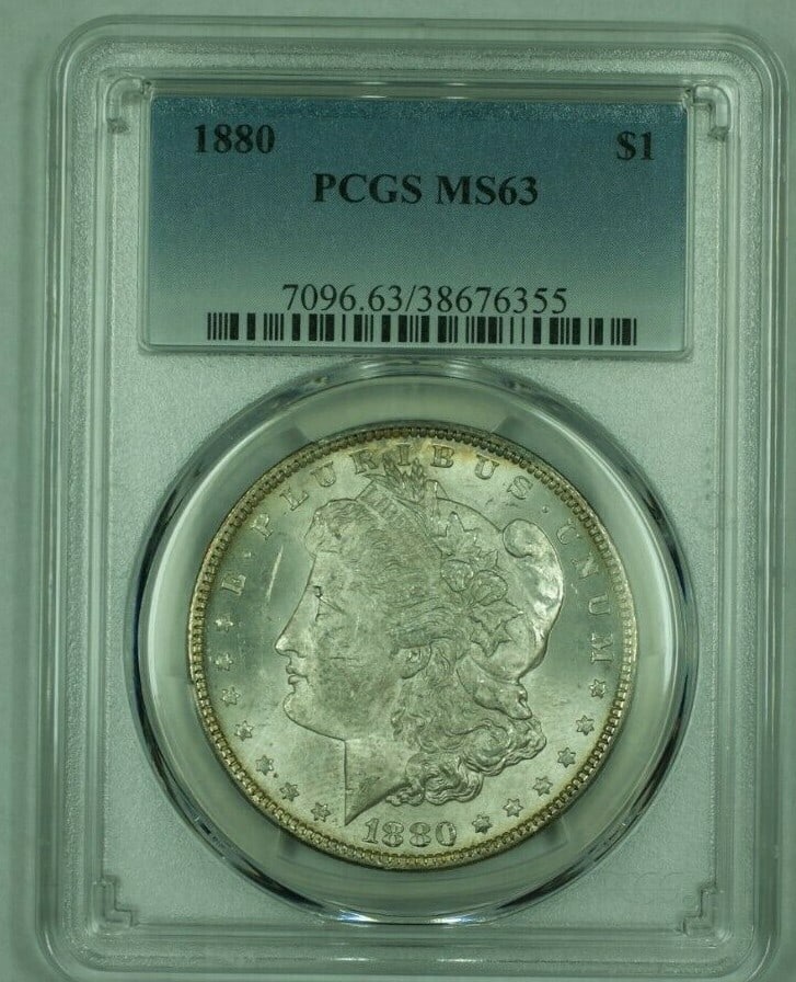 PCGS MS-63 1880 Morgan Dollar Philadelphia Mint Lightly Toned Silver $1 Coin (26): PCGS MS-63 1880 Morgan Dollar Philadelphia Mint Lightly Toned Silver $1 Coin (26) This 1880 Morgan Silver Dollar was minted in Philadelphia and is graded MS-63 by PCGS. The coin is composed of 90% sil