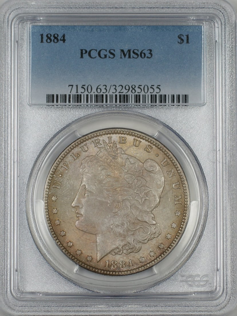PCGS MS-63 Toned 1884 Silver Morgan Dollar Philadelphia Mint: PCGS MS-63 Toned 1884 Silver Morgan Dollar Philadelphia Mint This 1884 Morgan Silver Dollar features a $1 denomination and is graded MS-63 by PCGS. The coin is uncirculated and displays attractive ton