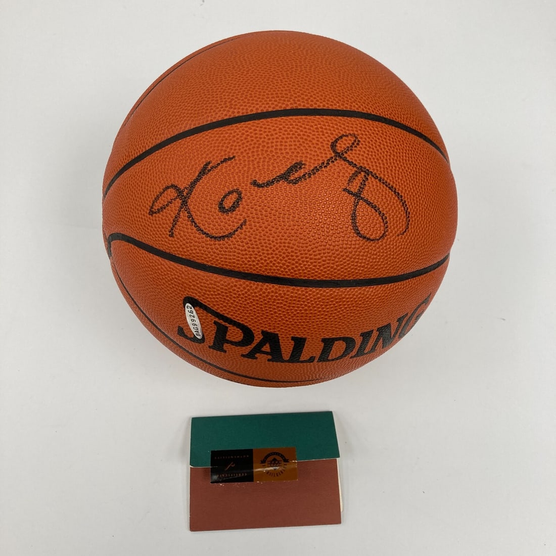 Kobe Bryant Signed Spalding Basketball with Upper Deck COA: Kobe Bryant Signed Spalding Basketball with Upper Deck COA This is a rare collectible item: a Kobe Bryant signed Spalding official game basketball, authenticated by Upper Deck. This basketball feature
