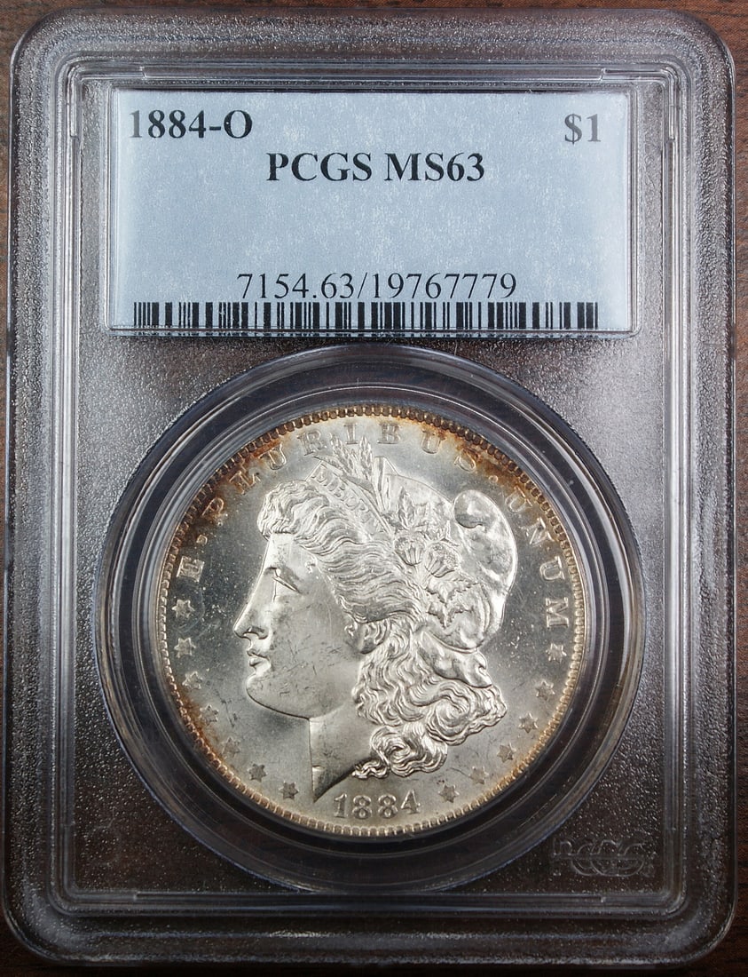 PCGS MS-63 1884-O Morgan Dollar Blob O Variety Silver Coin: PCGS MS-63 1884-O Morgan Dollar Blob O Variety Silver Coin This is an 1884-O Morgan Silver Dollar certified by PCGS with a grade of MS-63. Minted in New Orleans, this uncirculated coin features the 'B