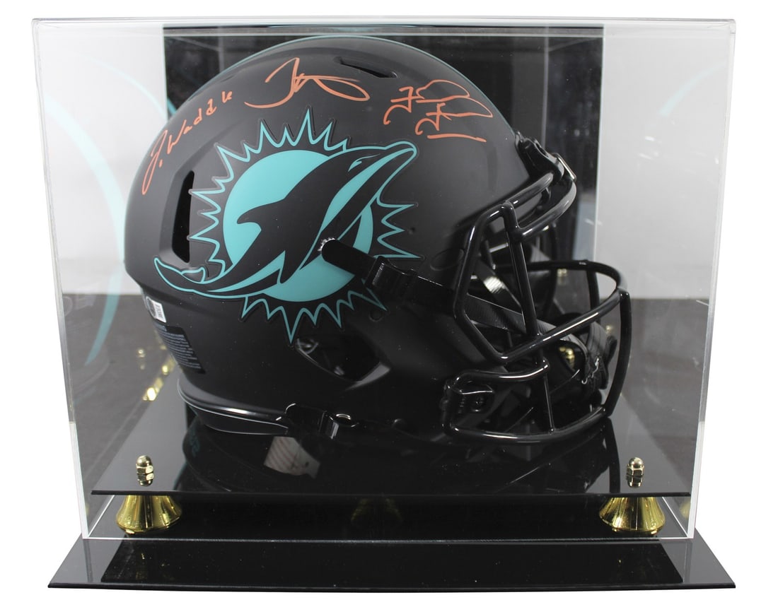 Miami Dolphins Signed Eclipse Helmet by Waddle Tagovailoa Hill with Beckett Authentication: Miami Dolphins Signed Eclipse Helmet by Waddle Tagovailoa Hill with Beckett Authentication This autographed Miami Dolphins Eclipse Riddell Full Size Speed Proline Helmet features the signatures of thr