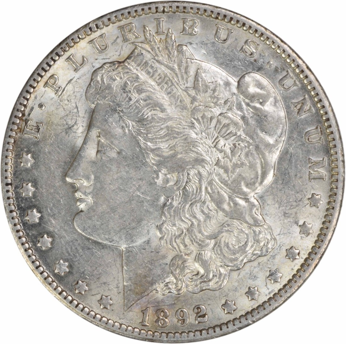 1892 New Orleans Morgan Dollar 90 Percent Silver AU Grade Uncertified: 1892 New Orleans Morgan Dollar 90 Percent Silver AU Grade Uncertified This is an 1892-O Morgan Silver Dollar from the New Orleans Mint. The coin is circulated and uncertified, featuring an AU (About U