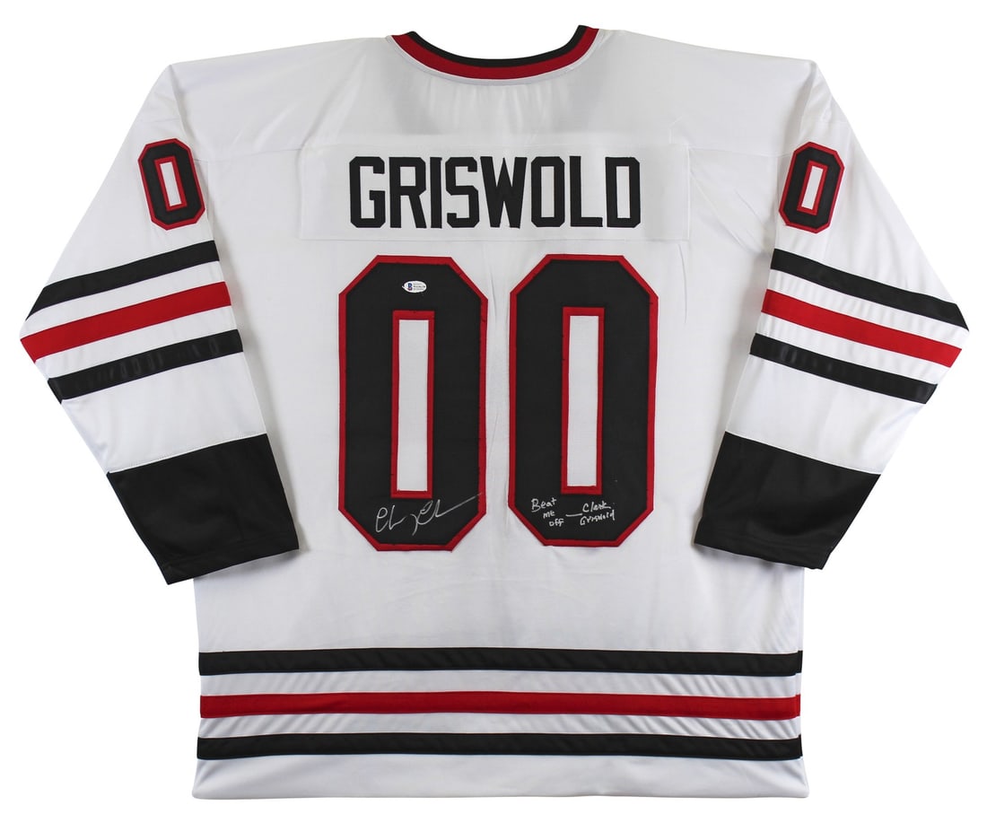 Chevy Chase Autographed Hockey Jersey Beat Me Off Clark Griswold BAS Authenticated: Chevy Chase Autographed Hockey Jersey Beat Me Off Clark Griswold BAS Authenticated This authentic autographed Griswold hockey jersey features the inscription "Beat me off - Clark Griswold" and has bee