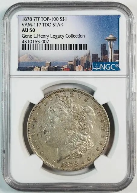 NGC AU-50 1878 7 Tail Feathers Morgan Dollar VAM-117 from Gene Henry Collection: NGC AU-50 1878 7 Tail Feathers Morgan Dollar VAM-117 from Gene Henry Collection This 1878 7TF Morgan Silver Dollar is certified by NGC with an AU-50 grade. It is attributed as VAM-117 TDO STAR and ori