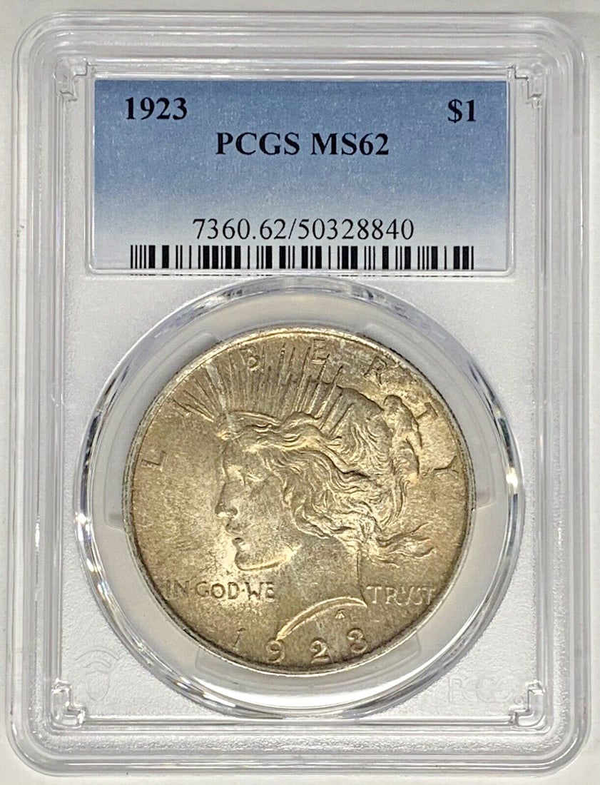 Toned 1923 Peace Silver Dollar PCGS MS 62 Certified Uncirculated Coin: Toned 1923 Peace Silver Dollar PCGS MS 62 Certified Uncirculated Coin This 1923 Peace Silver Dollar coin features attractive toning and has been graded MS 62 by PCGS. It is uncirculated and composed o