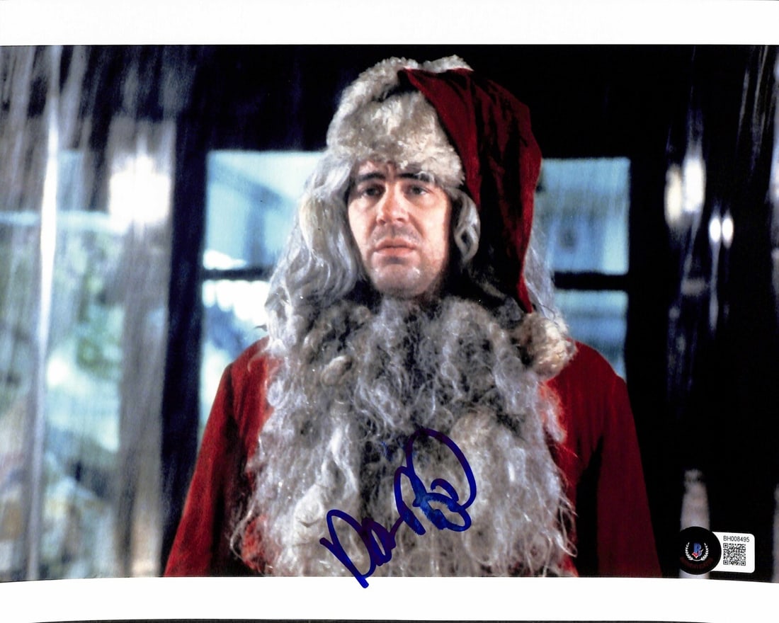 Dan Aykroyd Signed 8x10 Photo as Louis Winthorpe III Beckett Certified: Dan Aykroyd Signed 8x10 Photo as Louis Winthorpe III Beckett Certified This autographed 8x10 color photograph features Dan Aykroyd portraying Louis Winthorpe III from the classic film Trading Places.