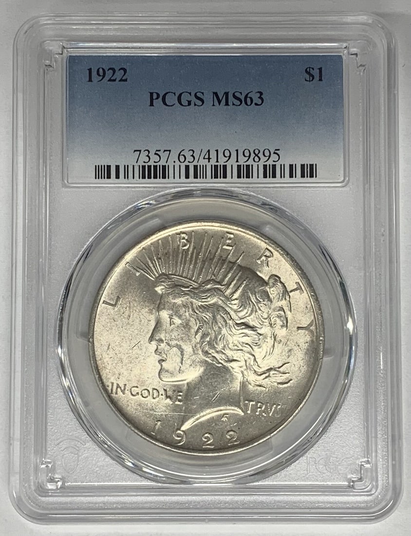 PCGS MS 63 1922 Peace Dollar Silver Coin United States: PCGS MS 63 1922 Peace Dollar Silver Coin United States This 1922 Peace Silver Dollar coin is certified by PCGS with a grade of MS 63. The coin is uncirculated and composed of silver, featuring the ico