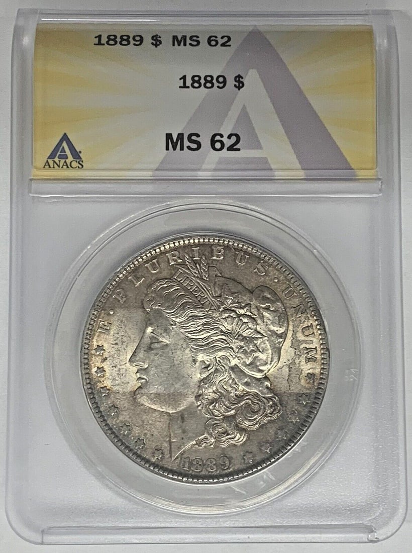 ANACS MS62 1889 Toned Morgan One Dollar Silver Coin: ANACS MS62 1889 Toned Morgan One Dollar Silver Coin This 1889 Morgan Silver Dollar is an uncirculated coin certified by ANACS with a grade of MS 62. It features attractive toning and is composed of si