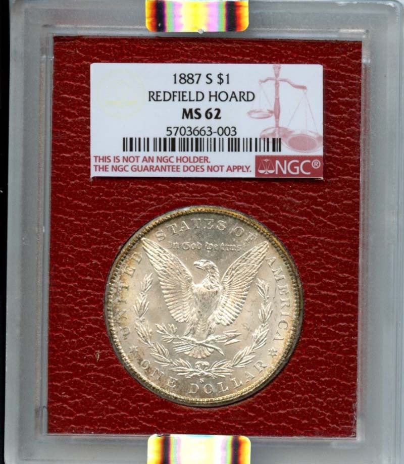 1887-S NGC MS62 Morgan Dollar Redfield Hoard Uncirculated: 1887-S NGC MS62 Morgan Dollar Redfield Hoard Uncirculated This 1887-S Morgan Dollar is a highly sought-after coin, certified by NGC with a grade of MS62, indicating its uncirculated condition. Minted