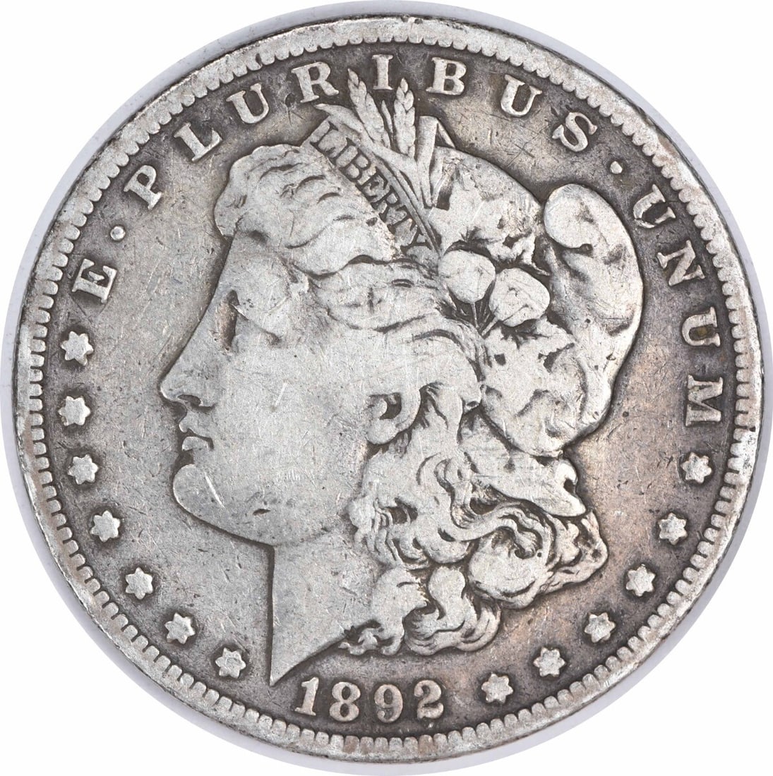 1892 San Francisco Morgan Dollar Fine Grade 90 Percent Silver Uncertified: 1892 San Francisco Morgan Dollar Fine Grade 90 Percent Silver Uncertified This is an 1892-S Morgan Silver Dollar from the San Francisco Mint. The coin is composed of 90% silver and 10% copper, weighs
