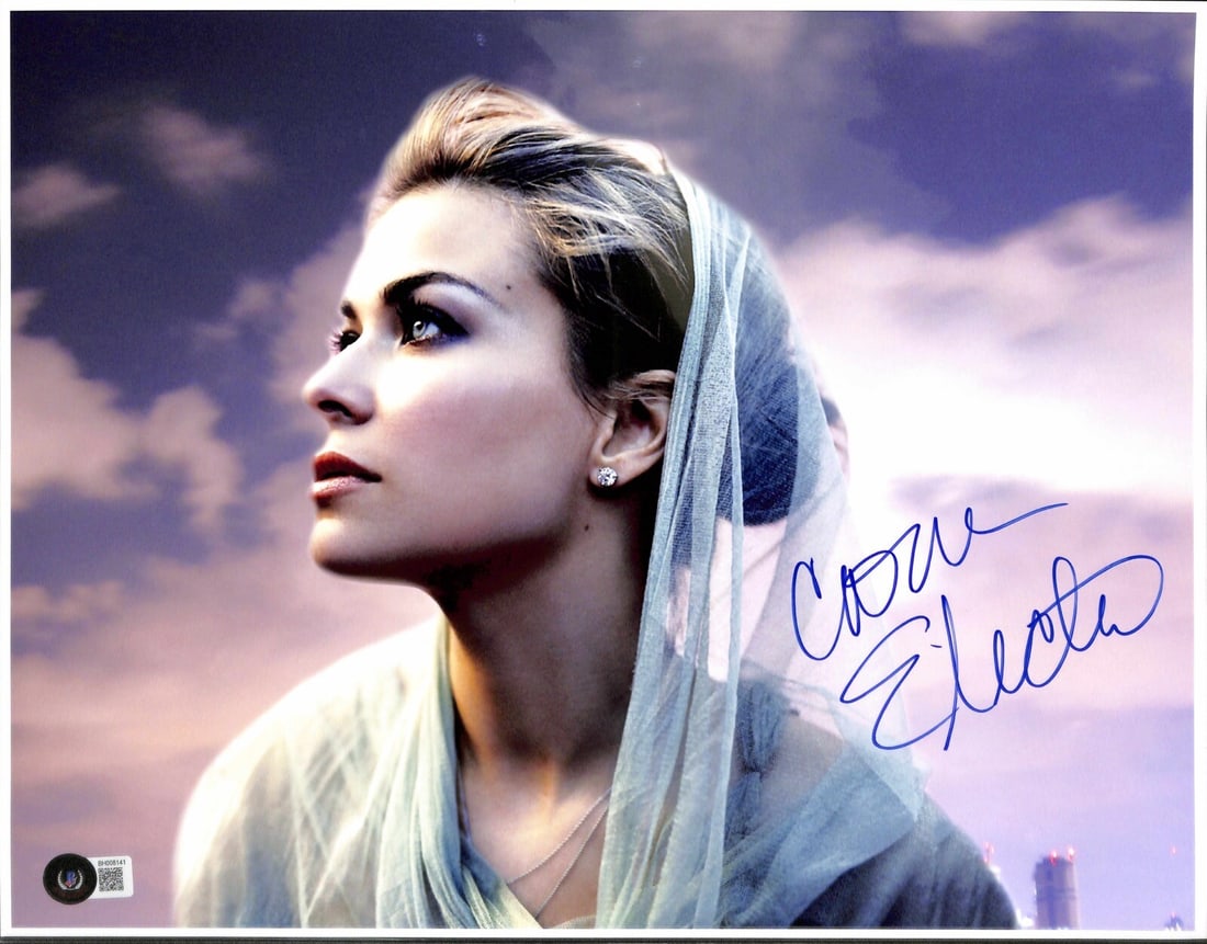 Carmen Electra Signed 11x14 Photo Beckett Certified: Carmen Electra Signed 11x14 Photo Beckett Certified This is an authentic 11x14 photograph signed by actress Carmen Electra, featuring her signature in black permanent marker. The autograph is certifie