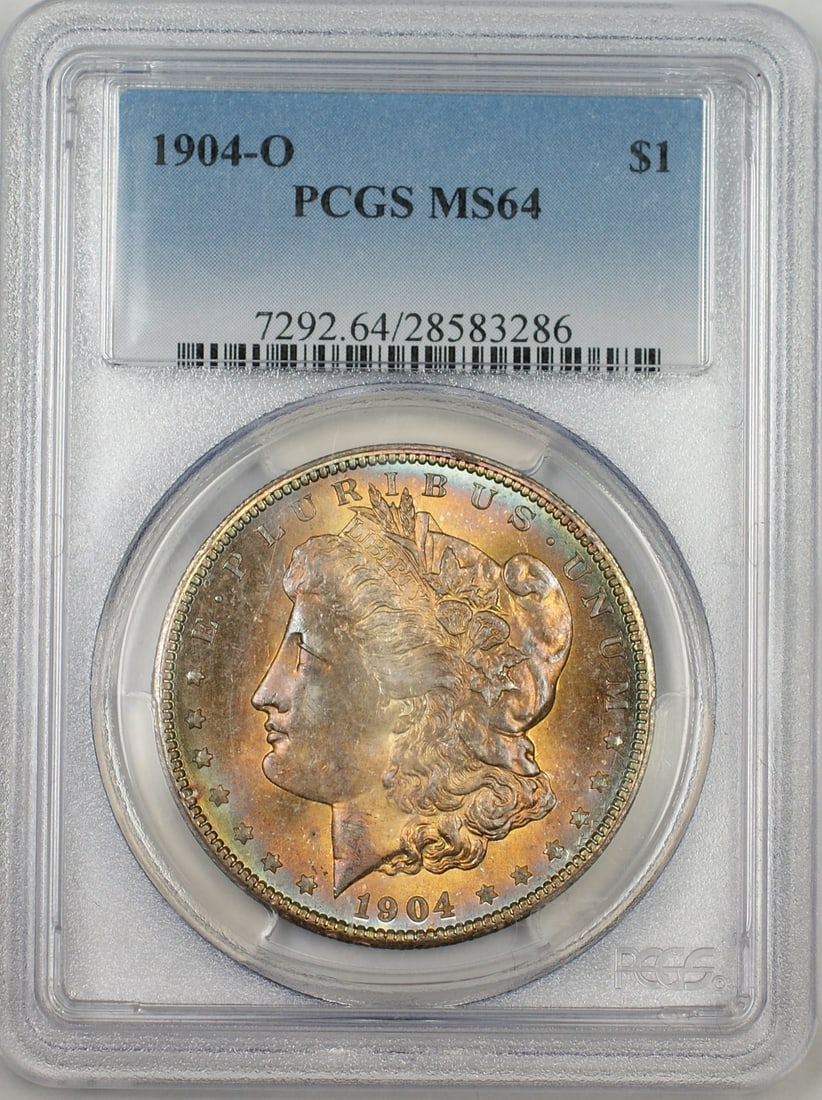 PCGS MS 64 1904-O Morgan Dollar Silver Coin With Colorful Toning: PCGS MS 64 1904-O Morgan Dollar Silver Coin With Colorful Toning This 1904-O Morgan Silver Dollar is graded MS-64 by PCGS and features colorful toning on both the obverse and reverse. Struck at the Ne