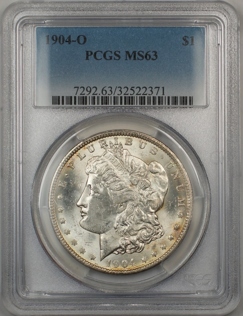 PCGS MS-63 1904-O Morgan Dollar Silver Coin from New Orleans Mint: PCGS MS-63 1904-O Morgan Dollar Silver Coin from New Orleans Mint This is a 1904-O Morgan Silver Dollar graded MS-63 by PCGS. Minted in New Orleans, this uncirculated coin is composed of silver and ha