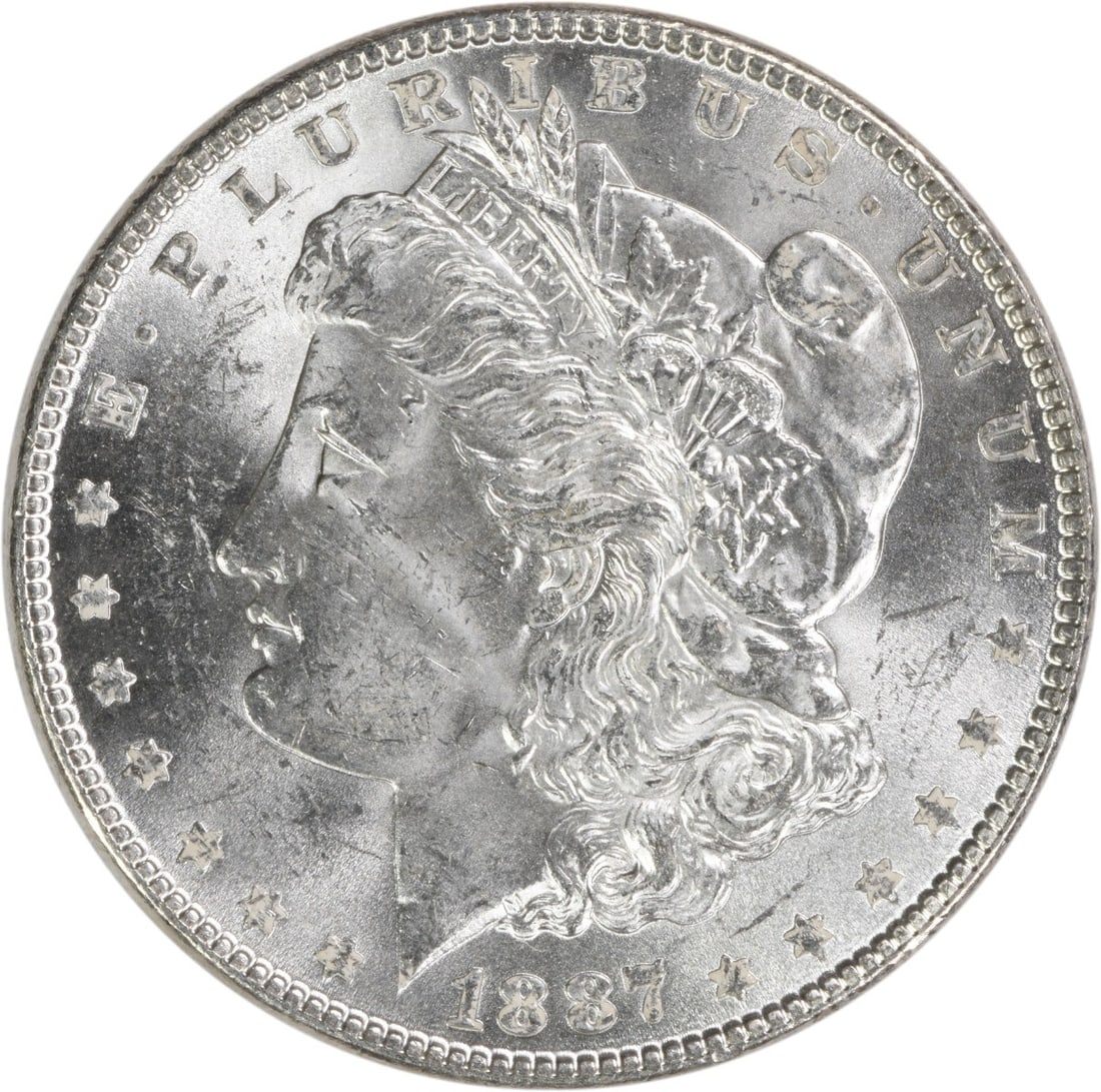 1887 Morgan Silver Dollar Uncertified Brilliant Uncirculated Silver Coin: 1887 Morgan Silver Dollar Uncertified Brilliant Uncirculated Silver Coin This 1887 Morgan Silver Dollar is a beautiful example of American coinage, showcasing its uncirculated condition. Crafted from