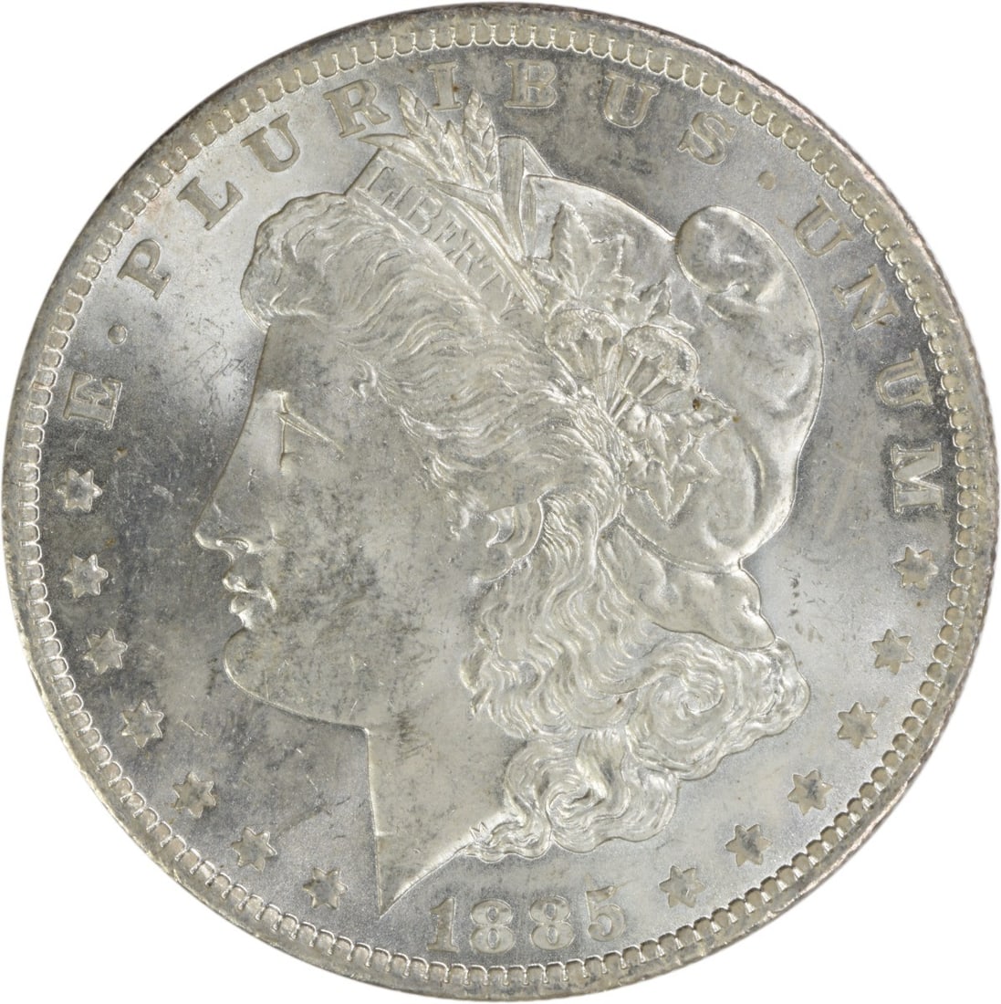 1885-O Morgan Silver Dollar Brilliant Uncirculated Silver Coin: 1885-O Morgan Silver Dollar Brilliant Uncirculated Silver Coin This 1885-O Morgan Silver Dollar is a stunning example of American coinage, featuring a beautiful uncirculated finish. The coin boasts a