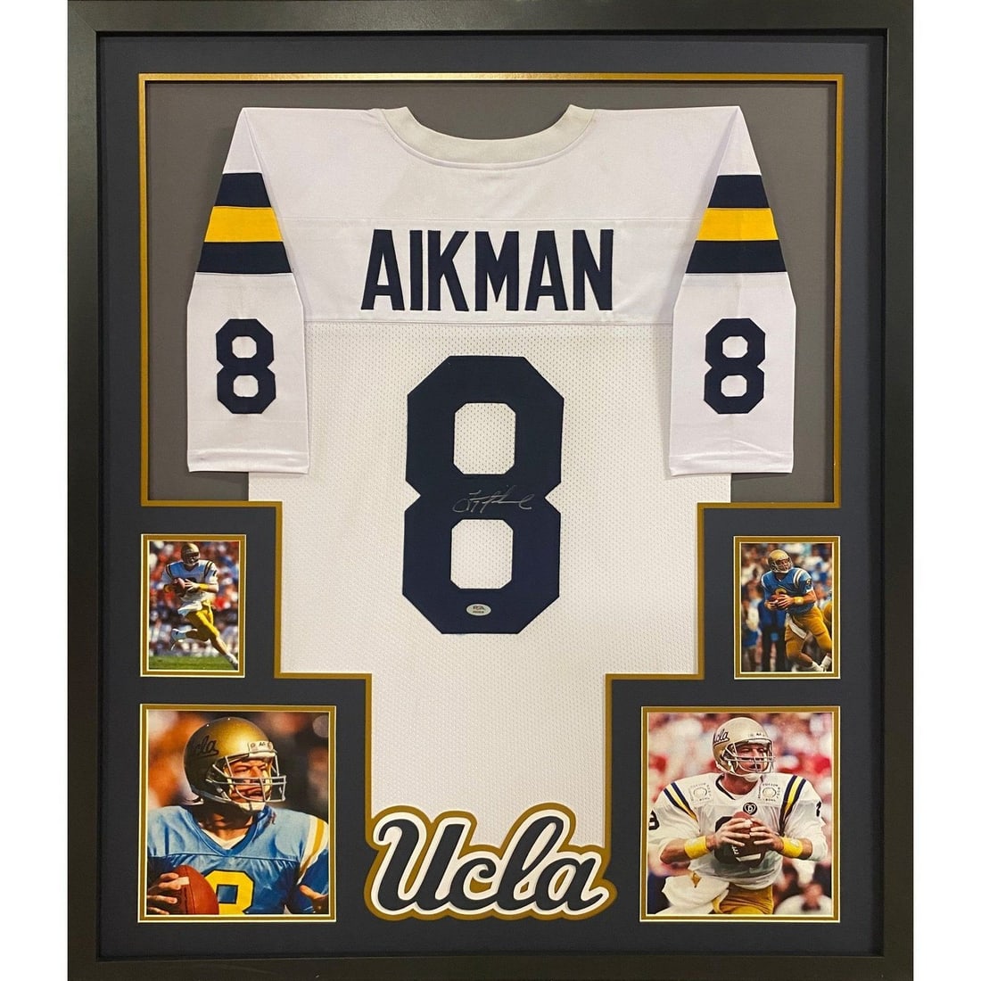Troy Aikman Autographed Framed UCLA Jersey PSA/DNA Certified: Troy Aikman Autographed Framed UCLA Jersey PSA/DNA Certified This collectible features an autographed Troy Aikman white UCLA jersey, beautifully framed for display. The jersey is authenticated by PSA/