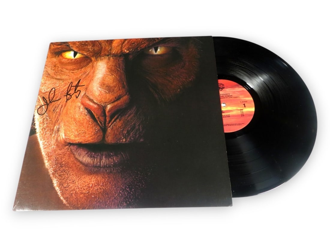 John Fogerty Autographed Eye of the Zombie Album Cover JSA: John Fogerty Autographed Eye of the Zombie Album Cover JSA This is an original record album cover of 'Eye of the Zombie' signed by John Fogerty. The autograph has been authenticated by James Spence Au