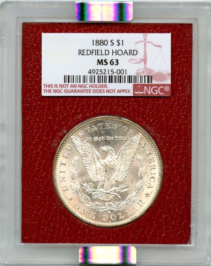 1880-S Morgan Dollar NGC MS63 Redfield Hoard Uncirculated: 1880-S Morgan Dollar NGC MS63 Redfield Hoard Uncirculated This 1880-S Morgan Dollar is a remarkable piece of numismatic history. Graded MS63 by NGC, it is classified as uncirculated, indicating its ex