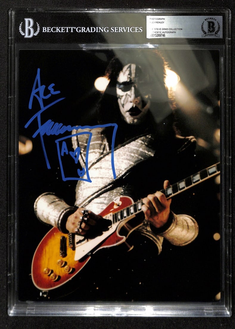 8x10 Photograph Signed by Ace Frehley of Kiss with Beckett Authentication: 8x10 Photograph Signed by Ace Frehley of Kiss with Beckett Authentication This 8x10 photograph features an authentic autograph by Ace Frehley of the band Kiss, signed in blue permanent marker. The sig