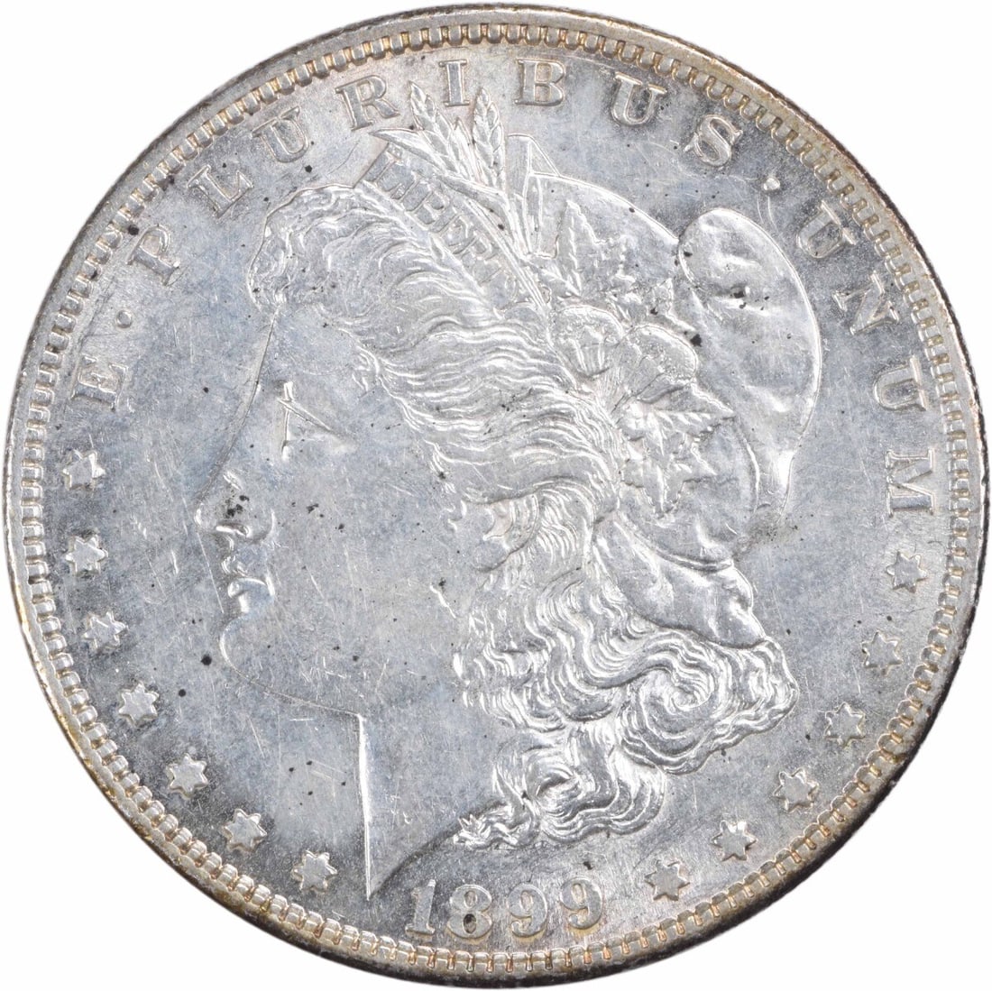 1899-S Morgan Silver Dollar AU Uncertified San Francisco Mint: 1899-S Morgan Silver Dollar AU Uncertified San Francisco Mint This 1899-S Morgan Silver Dollar is a classic piece of American numismatics, featuring a beautiful design by George T. Morgan. The coin is