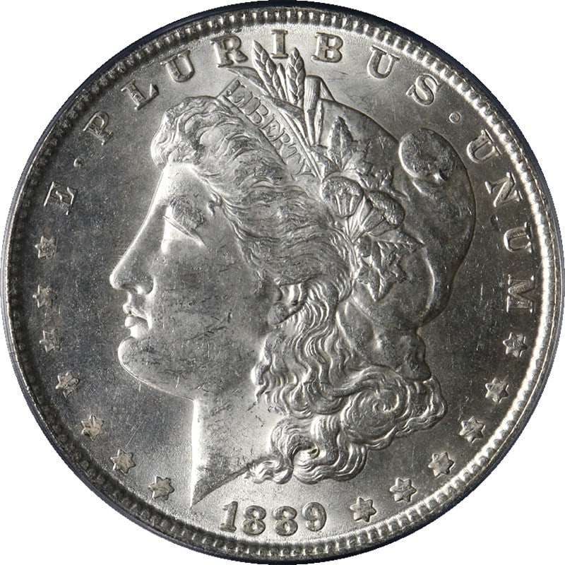 PCGS MS63 1889 P Morgan Silver Dollar Uncirculated Bright White Example: PCGS MS63 1889 P Morgan Silver Dollar Uncirculated Bright White Example This 1889-P Morgan Silver Dollar is certified by PCGS with a grade of MS63, indicating it is uncirculated and in excellent condi
