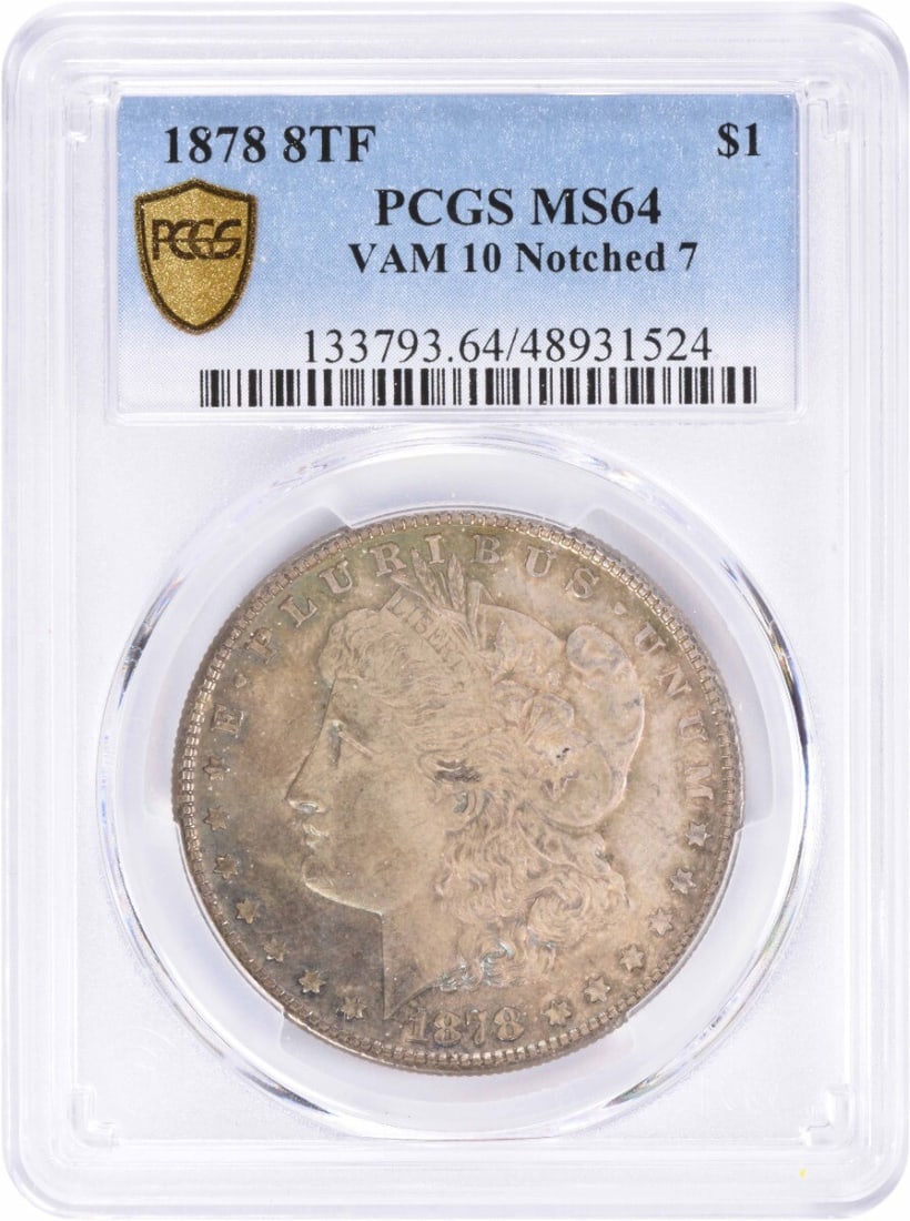 1878 Morgan Silver Dollar MS64 PCGS Notched 7 Uncirculated Coin: 1878 Morgan Silver Dollar MS64 PCGS Notched 7 Uncirculated Coin This 1878 Morgan Silver Dollar showcases a stunning design by George T. Morgan, featuring a notched 7 variety. Graded MS64 by PCGS, this