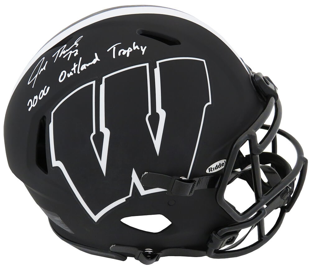 Joe Thomas Signed Wisconsin Badgers Eclipse Riddell Helmet with 2006 Outland Inscription: Joe Thomas Signed Wisconsin Badgers Eclipse Riddell Helmet with 2006 Outland Inscription This is a Joe Thomas signed Wisconsin Badgers Eclipse black matte Riddell authentic proline speed full-size hel