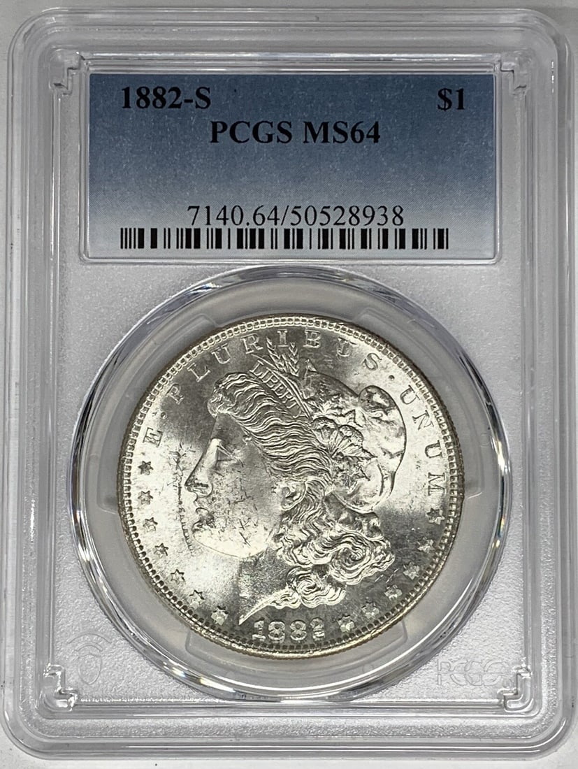 PCGS MS 64 1882-S Silver Morgan Dollar Certified Uncirculated Coin: PCGS MS 64 1882-S Silver Morgan Dollar Certified Uncirculated Coin This is an 1882-S Morgan Silver Dollar graded MS 64 by PCGS. The coin is uncirculated and composed of silver, featuring the classic M