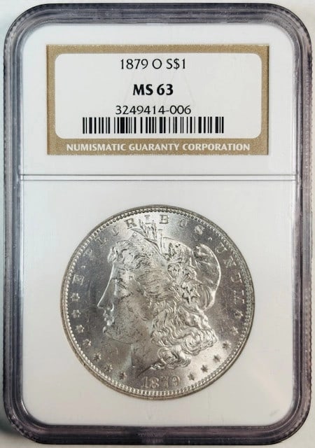 NGC MS63 1879 O Uncirculated Morgan Silver Dollar Coin: NGC MS63 1879 O Uncirculated Morgan Silver Dollar Coin This is an 1879 Morgan Silver Dollar minted in New Orleans and graded MS 63 by NGC. The coin is uncirculated and features a white appearance. It