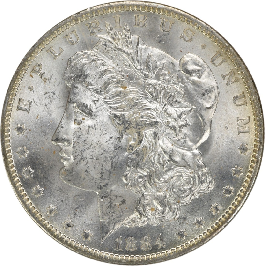 1884-O Morgan Silver Dollar Uncertified BU Silver Coin: 1884-O Morgan Silver Dollar Uncertified BU Silver Coin This 1884-O Morgan Silver Dollar is an uncirculated coin featuring a beautiful finish, indicative of its Brilliant Uncirculated (BU) grade. Struc