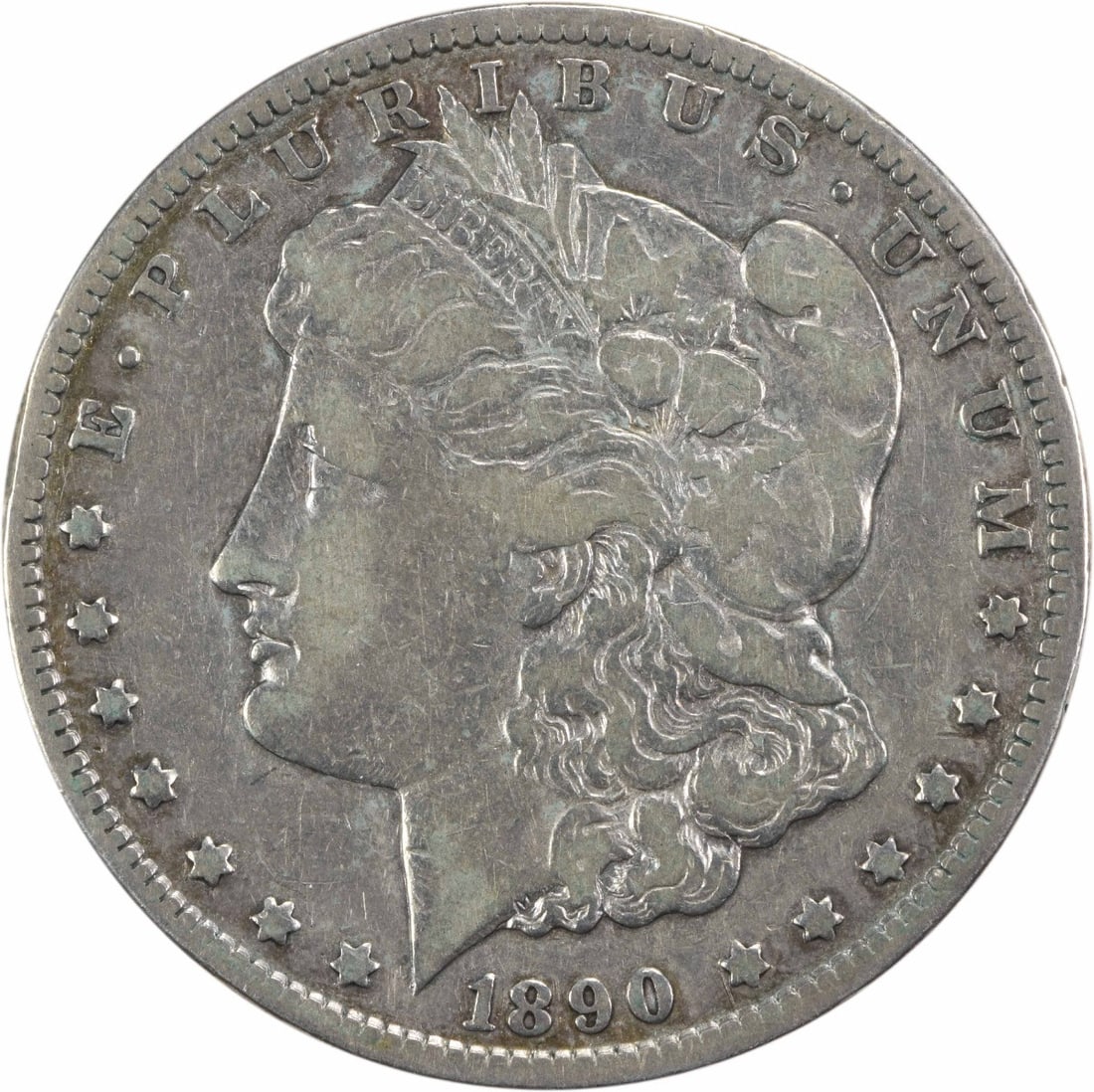 1890-CC Morgan Silver Dollar VF Uncertified 90% Silver Coin: 1890-CC Morgan Silver Dollar VF Uncertified 90% Silver Coin This 1890-CC Morgan Silver Dollar features a striking design by George T. Morgan and is a sought-after collectible for coin enthusiasts. It