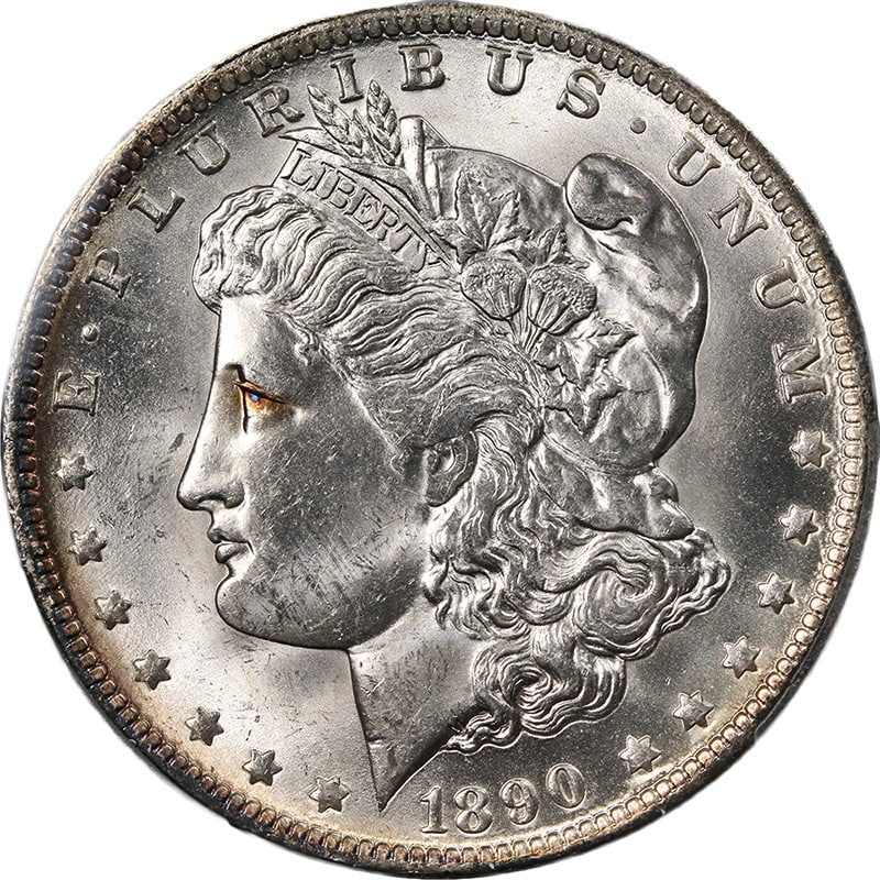 1890-O Morgan Silver Dollar PCGS MS63+ Black Eye Variety: 1890-O Morgan Silver Dollar PCGS MS63+ Black Eye Variety This 1890-O Morgan Silver Dollar is a stunning piece that showcases nice luster and decent eye appeal. It features the 'Black Eye' variety, wit