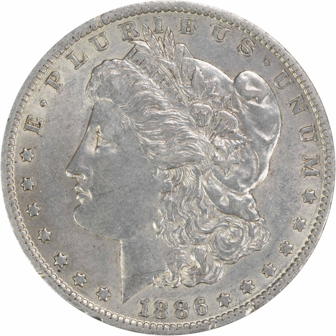 AU Grade 1886 O Morgan Dollar Uncertified 90 Percent Silver Coin: AU Grade 1886 O Morgan Dollar Uncertified 90 Percent Silver Coin This 1886-O Morgan Silver Dollar is a circulated coin from the New Orleans Mint, designed by George T. Morgan. It is composed of 90% si