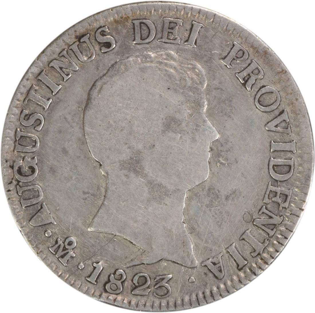 1823 Mo JM Mexico Iturbide 2 Reales KM303 Silver Coin: 1823 Mo JM Mexico Iturbide 2 Reales KM303 Silver Coin This 1823 Mo JM Mexico - Iturbide 2 Reales (KM303) is a captivating piece of numismatic history. Crafted from silver, this coin has been circulate
